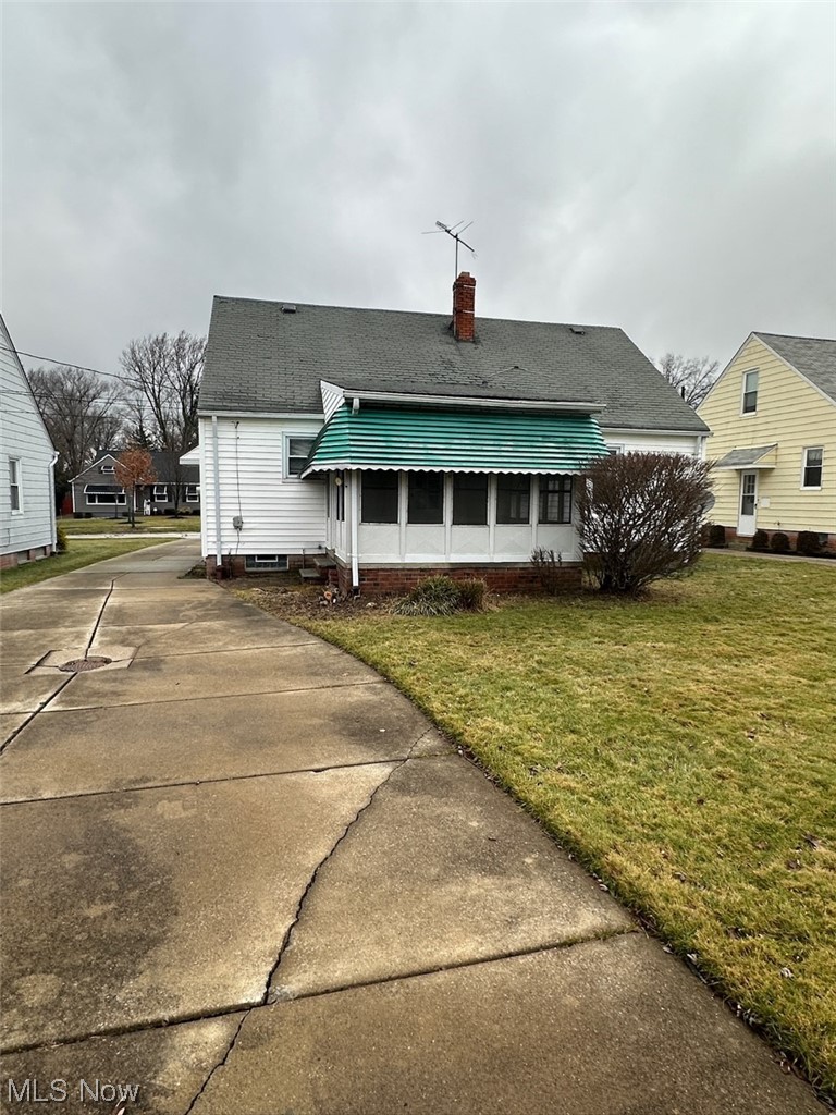 4994 North Barton Road Cleveland, OH 44124 - Photo 25 of 28 Rear view of house with a lawn