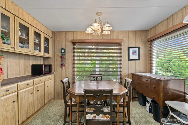 a view of a dining room with furniture window and outside view