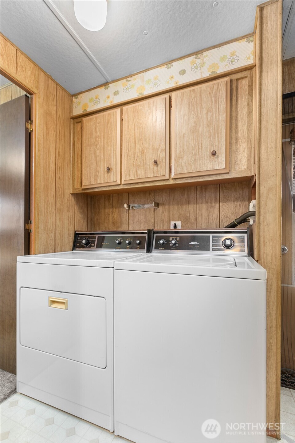 2522 Old Highway 99 South Road, Unit 2 Mount Vernon, WA 98273 - Photo 14 of 20 a kitchen with stainless steel appliances granite countertop a refrigerator a stove a sink and white cabinets with wooden floor
