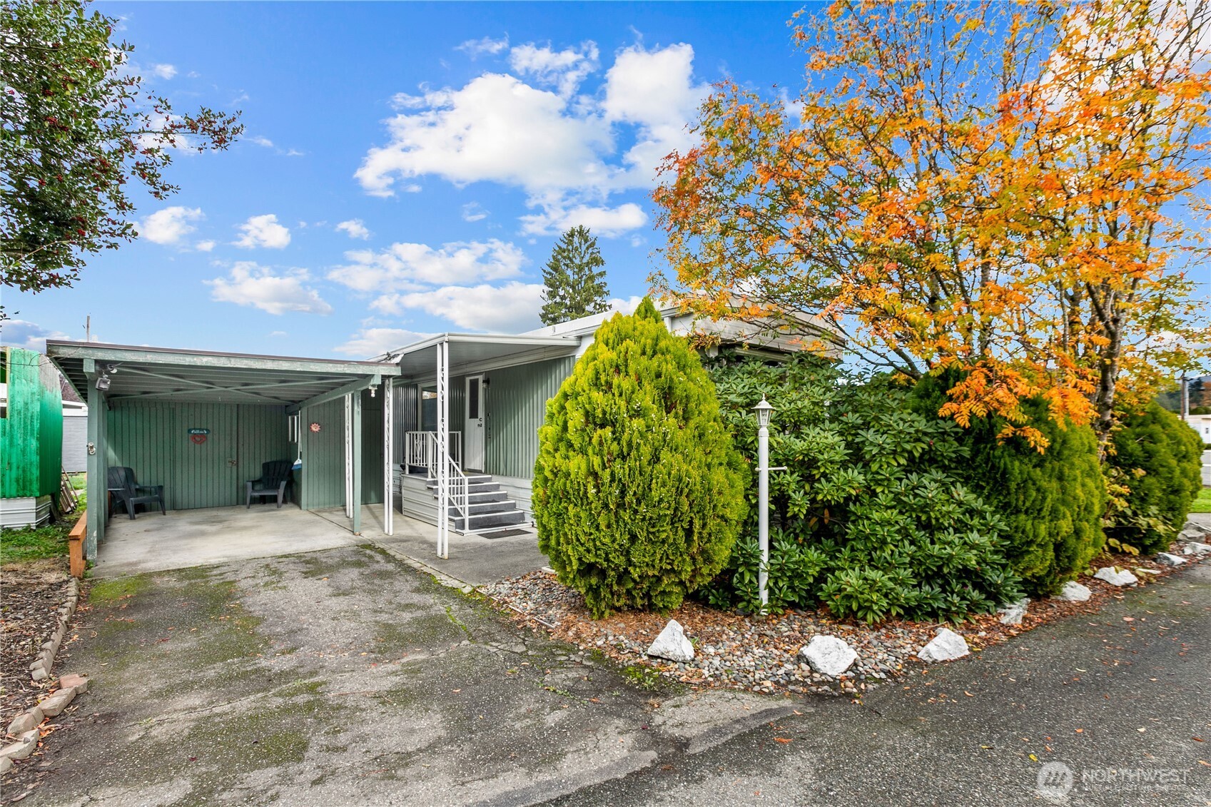 2522 Old Highway 99 South Road, Unit 2 Mount Vernon, WA 98273 - Photo 19 of 20 a view of a house with a small yard and potted plants