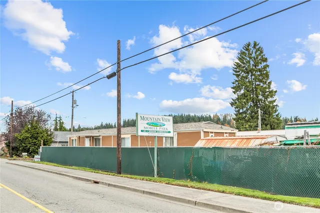 a view of a street with a building in the background