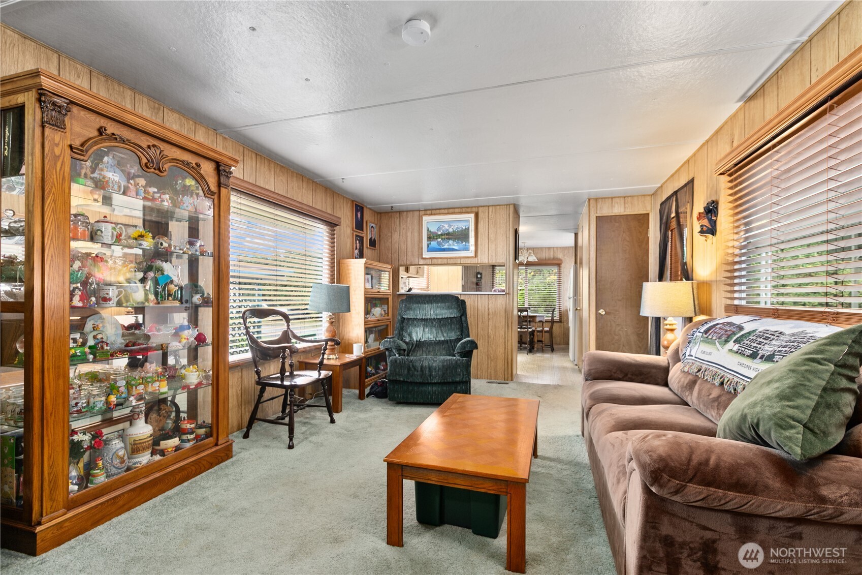 2522 Old Highway 99 South Road, Unit 2 Mount Vernon, WA 98273 - Photo 6 of 20 a living room with furniture a fireplace and a large window