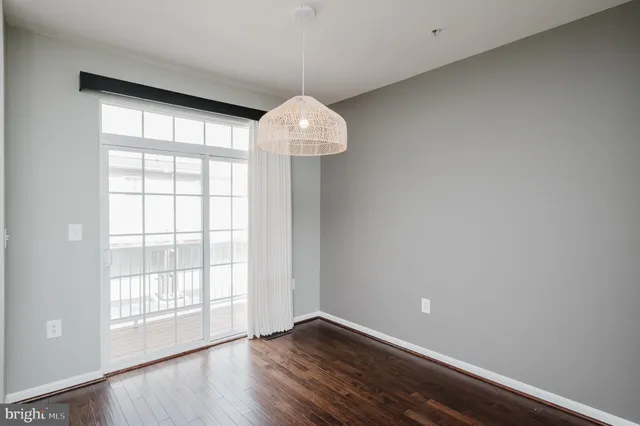 a kitchen with stainless steel appliances a stove a microwave and a refrigerator