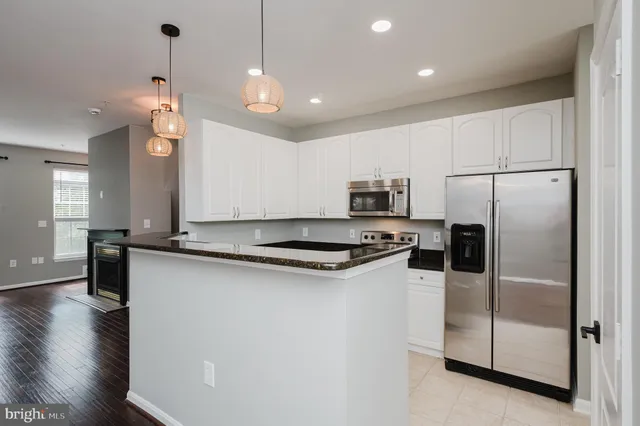 a view of a livingroom with a ceiling fan and window