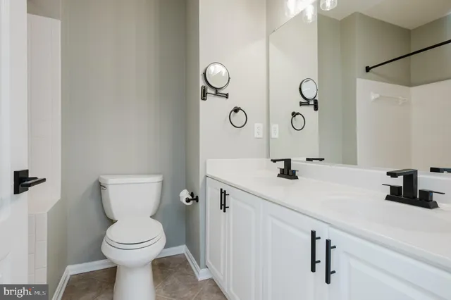 a view of a dining room with furniture large windows and wooden floor