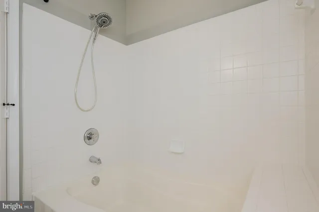 a view of a dining room with furniture large windows and wooden floor