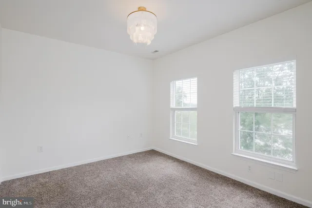a kitchen with counter top space a sink and appliances