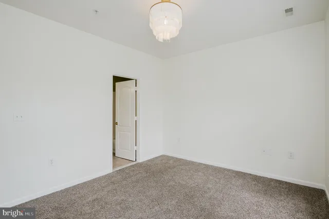 a view of a dining room with furniture and windows