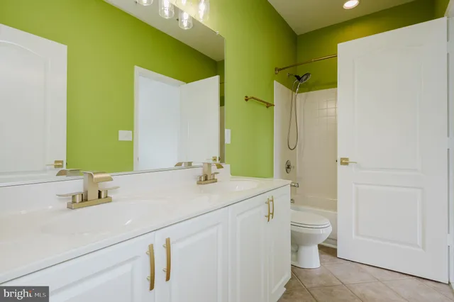 a living room with furniture a fireplace and a large window