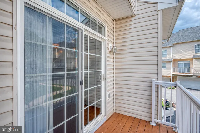 a view of a street with a building and trees in the background