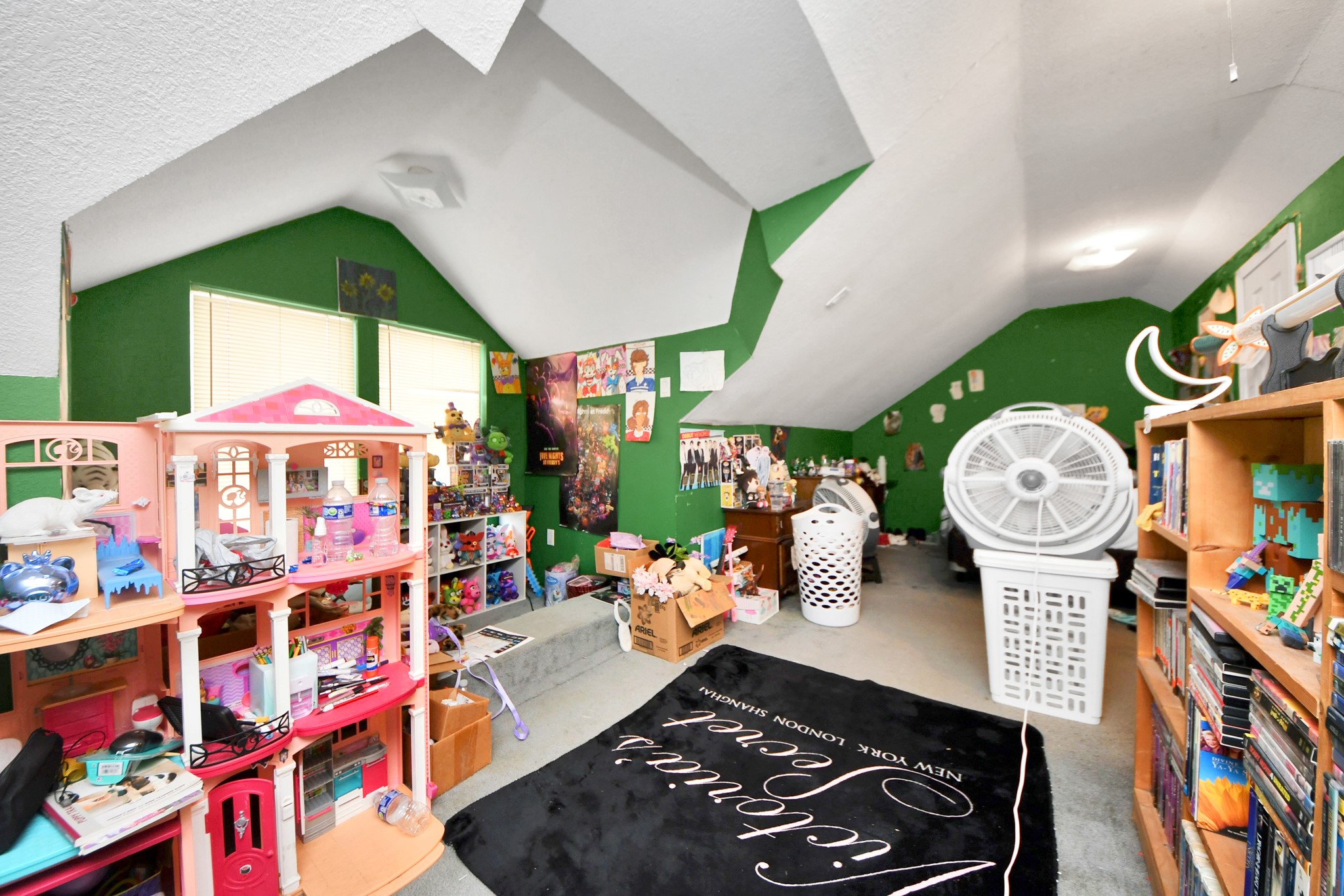 5134 Leeland Street Houston, TX 77023 - Photo 21 of 28 a room with lots of different furniture and lots of wooden floor