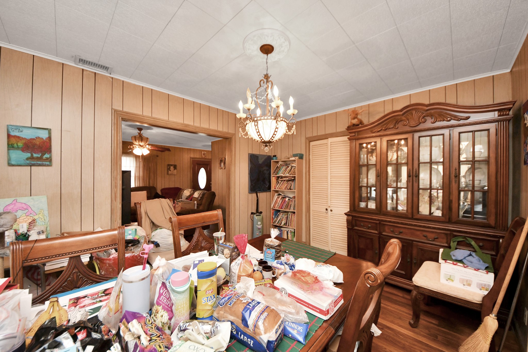 5134 Leeland Street Houston, TX 77023 - Photo 10 of 28 a living room with furniture and a chandelier