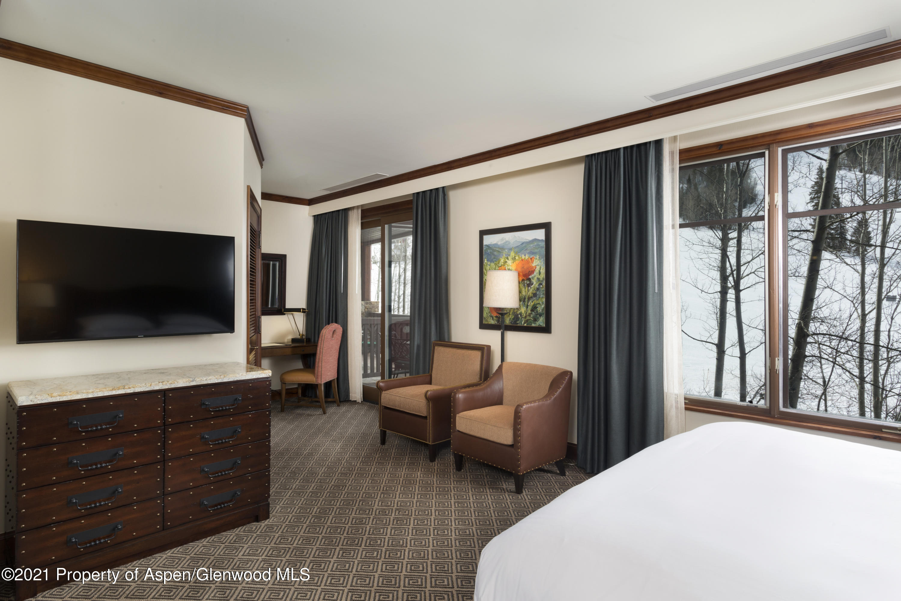 197 Prospector Road, Unit 2412 SUMMER INTEREST #10 Aspen, CO 81611 - Photo 12 of 22 a bedroom with two beds and a large window