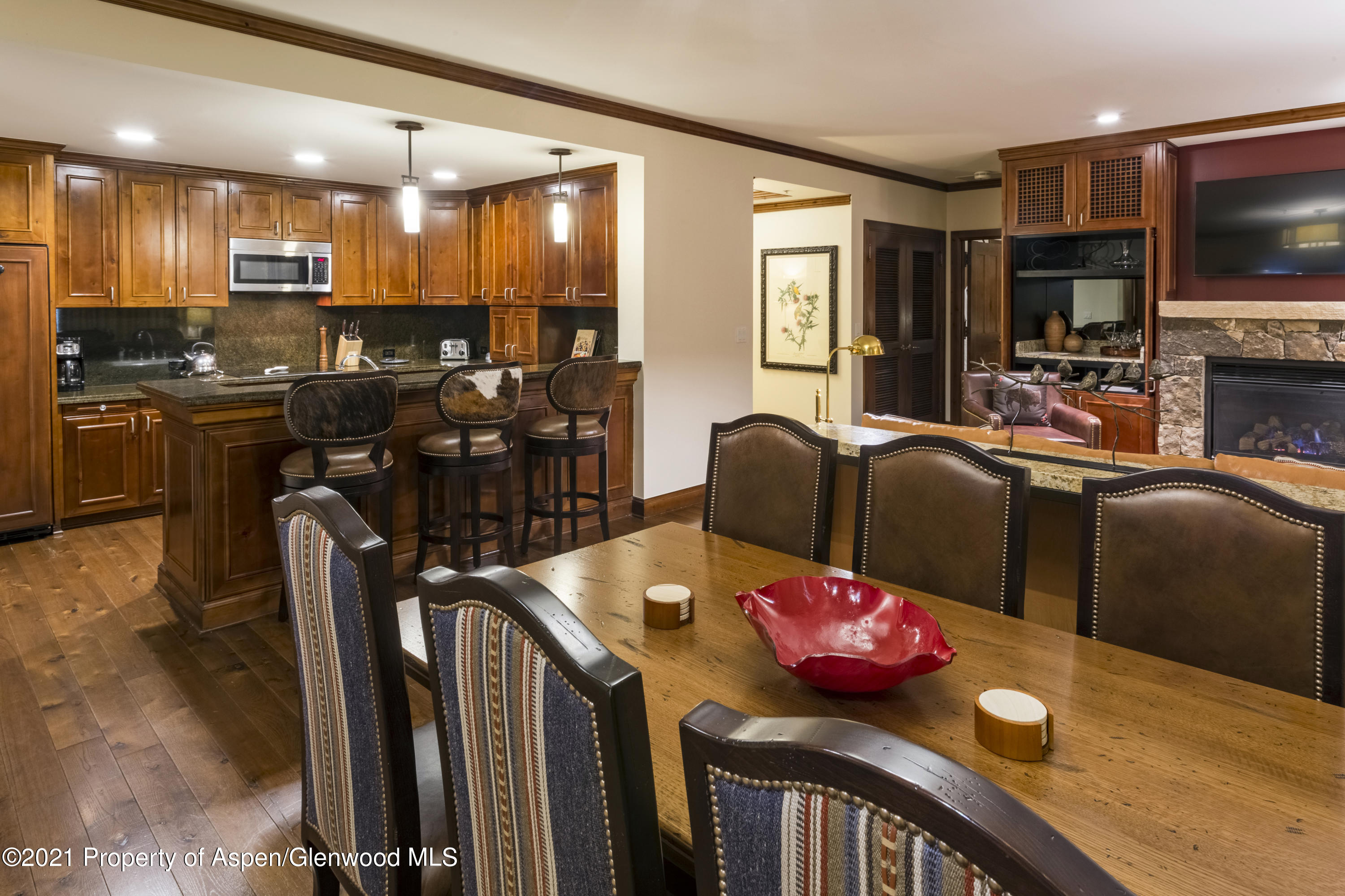 197 Prospector Road, Unit 2412 SUMMER INTEREST #10 Aspen, CO 81611 - Photo 7 of 22 a view of a dining room with furniture