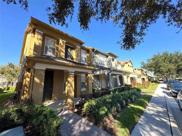 a view of a building with a yard