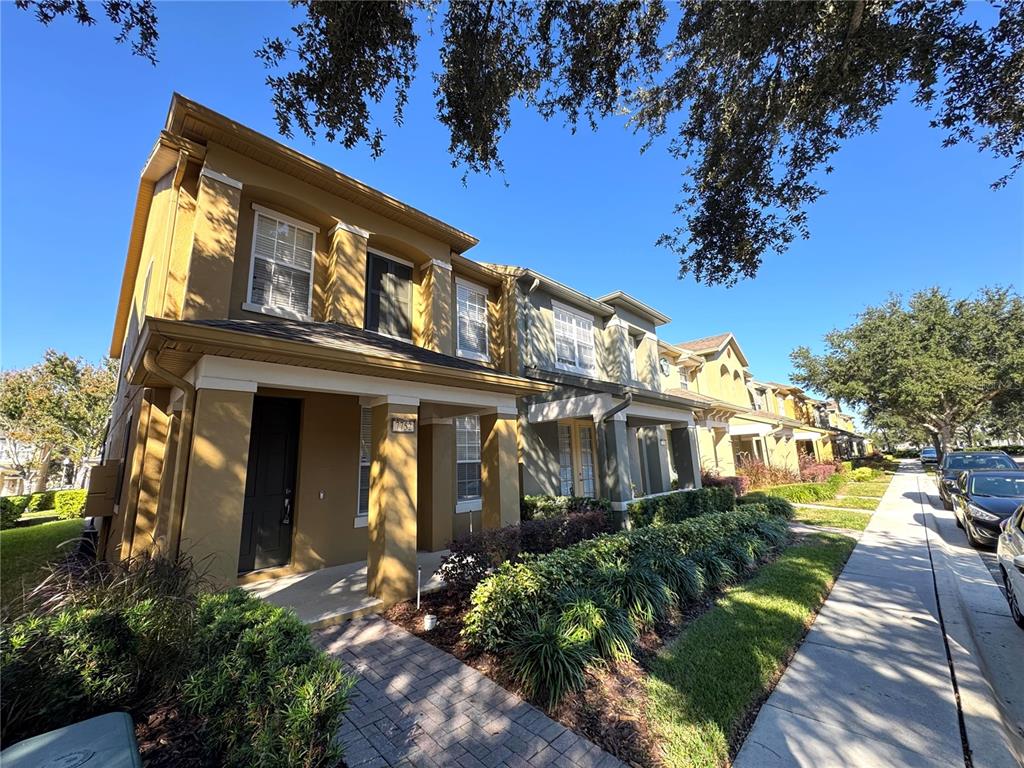 a view of a building with a yard