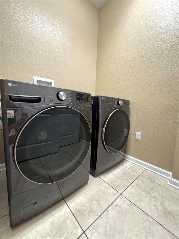 7752 Moser Avenue Windermere, FL 34786 - Photo 19 of 22 a utility room with dryer and washer