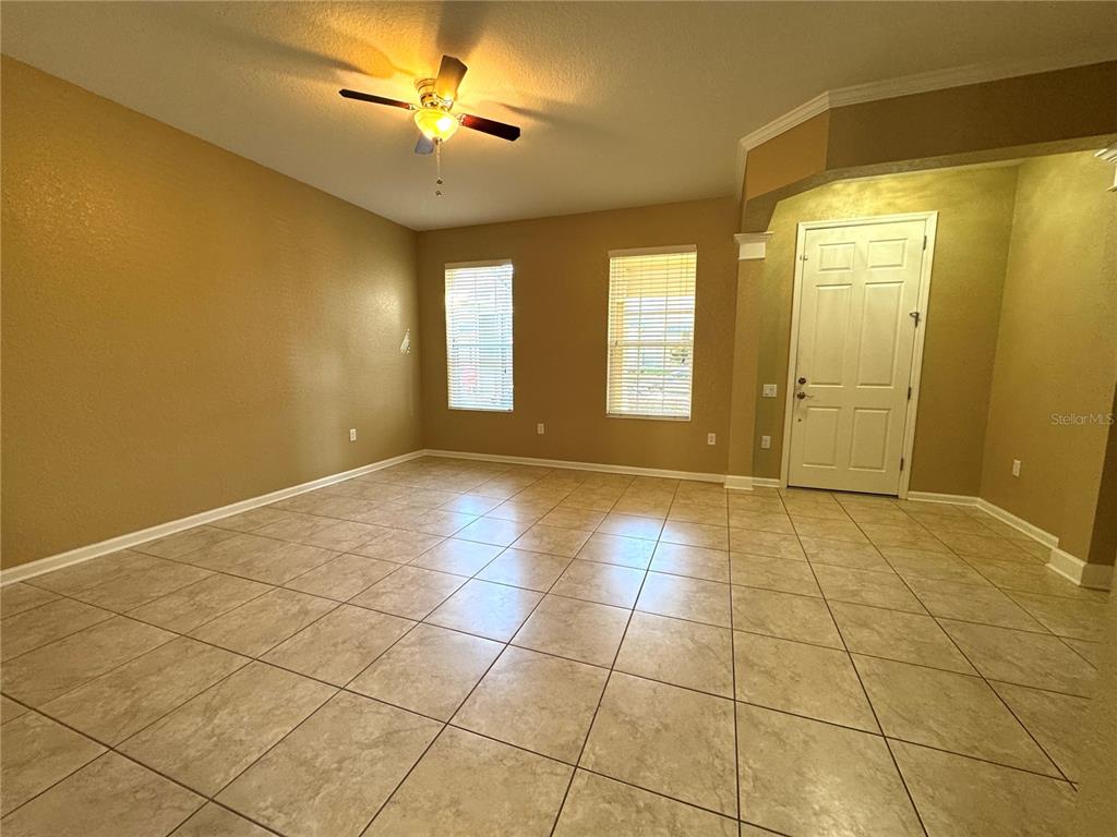 7752 Moser Avenue Windermere, FL 34786 - Photo 3 of 22 a view of an empty room with a window