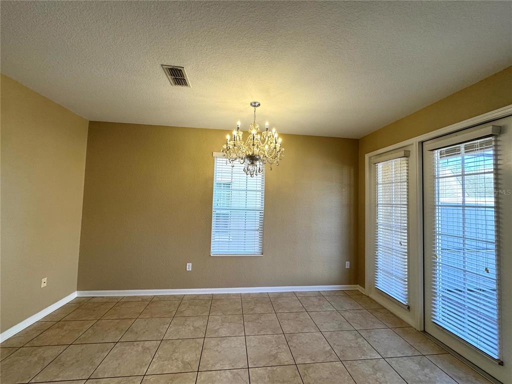 7752 Moser Avenue Windermere, FL 34786 - Photo 10 of 22 a view of an empty room with a window