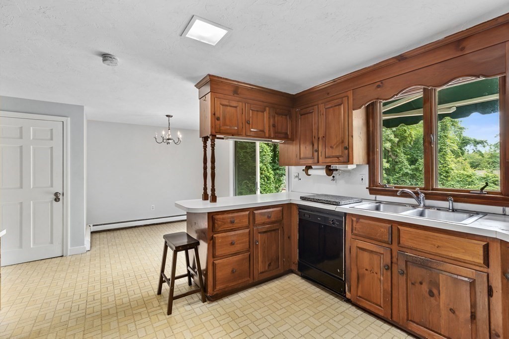 7 Conihasset Road Scituate, MA 02066 - Photo 12 of 34 a kitchen with a sink stove and cabinets