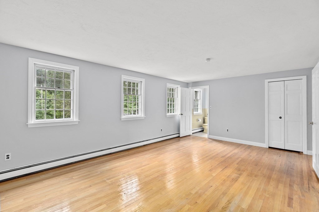 7 Conihasset Road Scituate, MA 02066 - Photo 20 of 34 a view of an empty room with wooden floor and a window