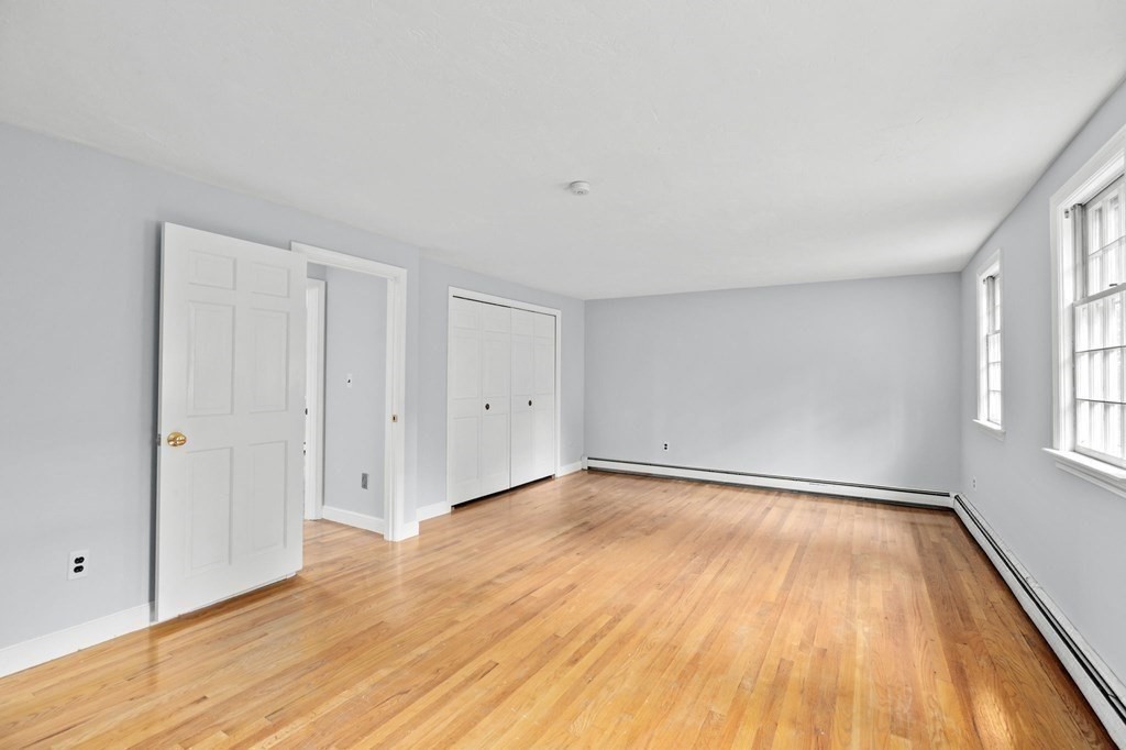 7 Conihasset Road Scituate, MA 02066 - Photo 21 of 34 a view of an empty room with wooden floor and a window