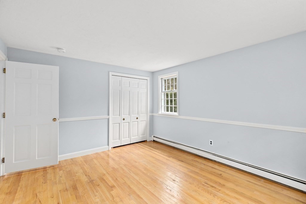 7 Conihasset Road Scituate, MA 02066 - Photo 24 of 34 a view of empty room with wooden floor and fan