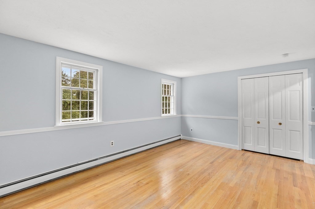 7 Conihasset Road Scituate, MA 02066 - Photo 26 of 34 a view of an empty room with wooden floor and a window