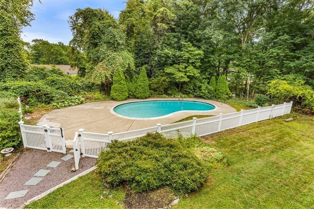 7 Conihasset Road Scituate, MA 02066 - Photo 27 of 34 a view of a backyard with plants and a patio