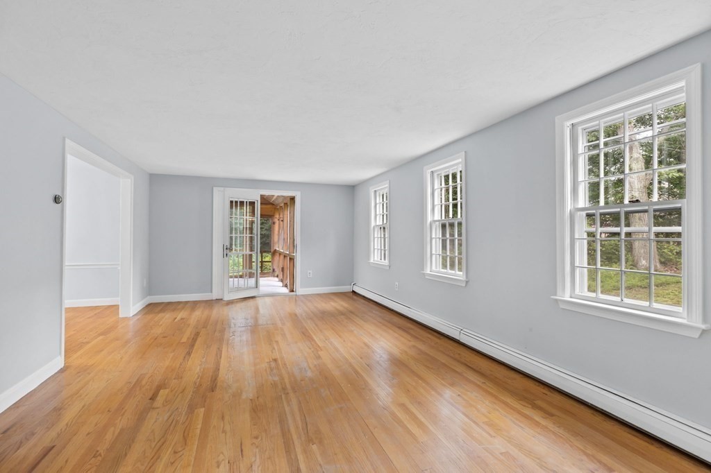 7 Conihasset Road Scituate, MA 02066 - Photo 7 of 34 a view of an empty room with wooden floor and a window