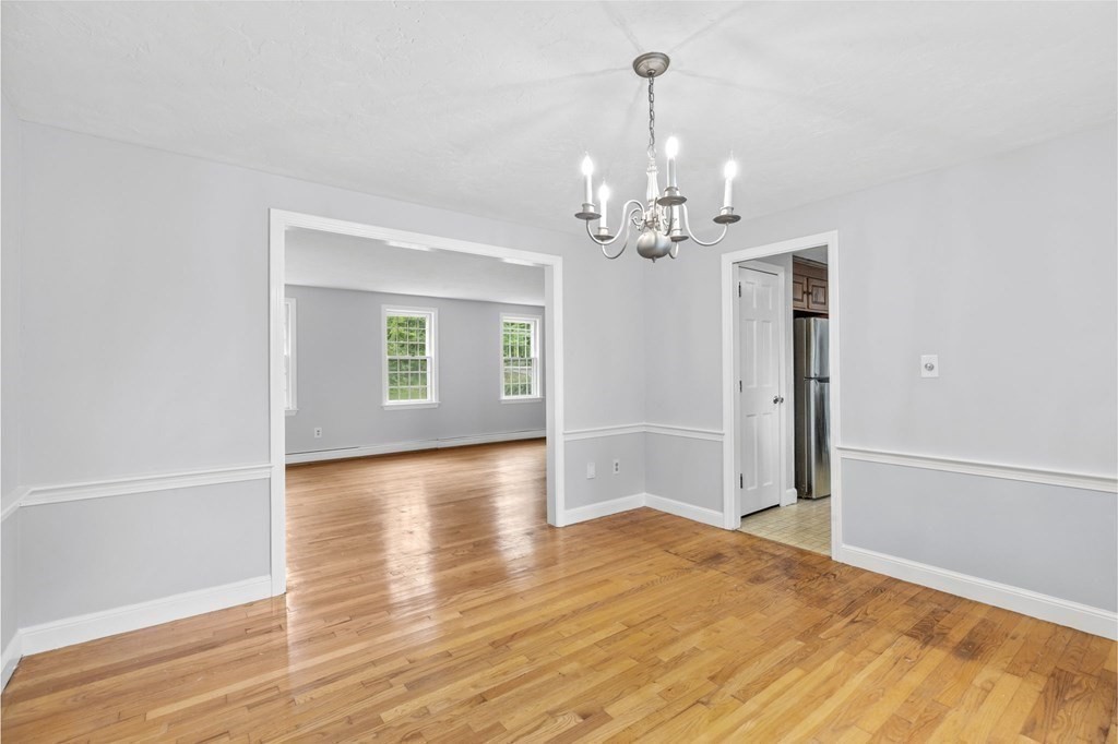 7 Conihasset Road Scituate, MA 02066 - Photo 8 of 34 a view of a livingroom with wooden floor and a ceiling fan