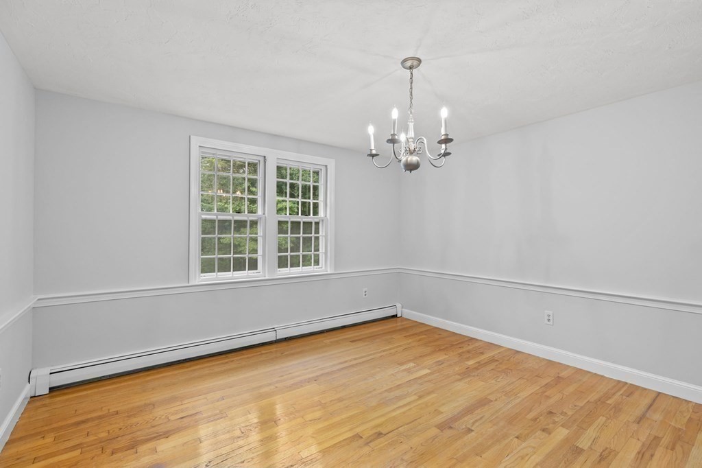 7 Conihasset Road Scituate, MA 02066 - Photo 9 of 34 a view of empty room with wooden floor and fan