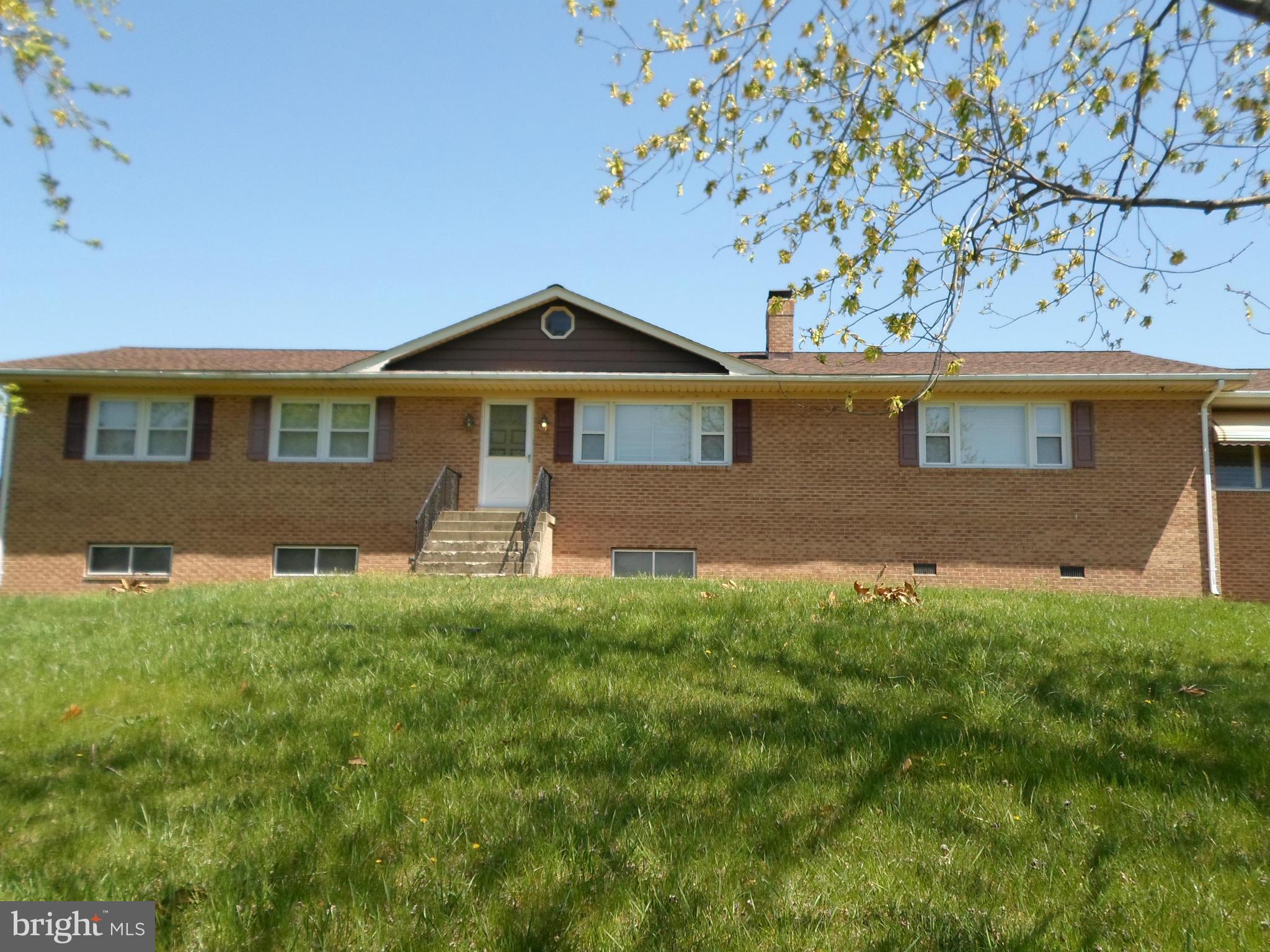 7410 South Osborne Road Upper Marlboro, MD 20772 - Photo 1 of 30 a front view of a house with a yard