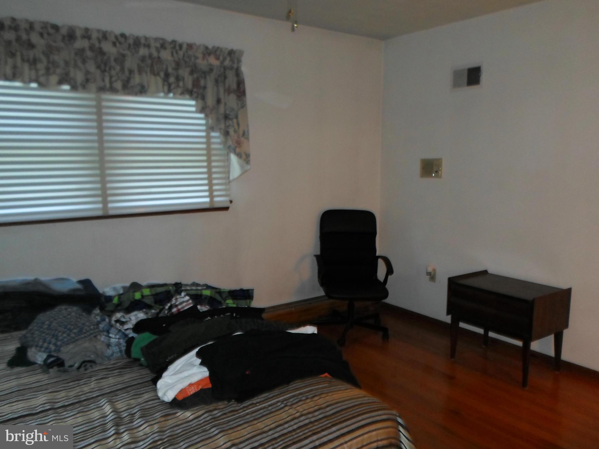 7410 South Osborne Road Upper Marlboro, MD 20772 - Photo 11 of 30 a living room with furniture and a wooden floor