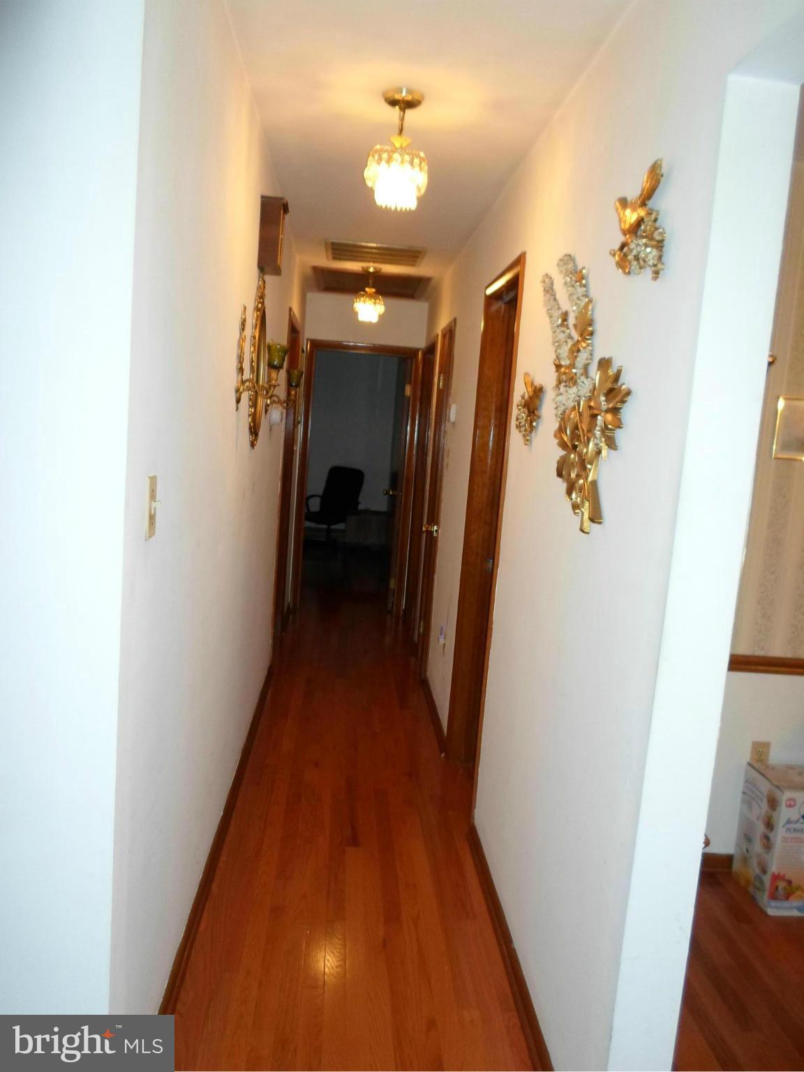 7410 South Osborne Road Upper Marlboro, MD 20772 - Photo 14 of 30 a view of hallway with wooden floor