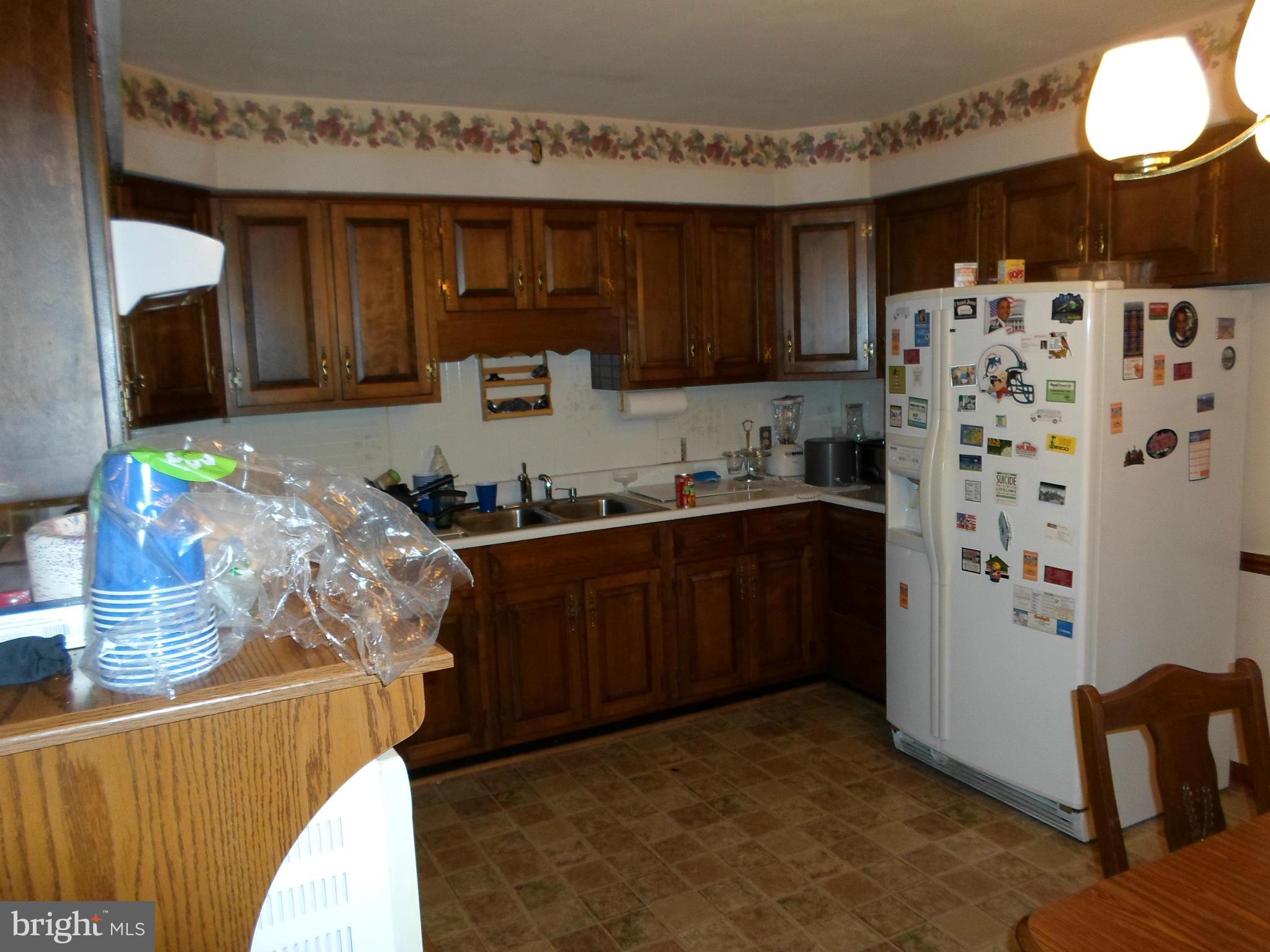 7410 South Osborne Road Upper Marlboro, MD 20772 - Photo 16 of 30 a kitchen with stainless steel appliances granite countertop a refrigerator and a stove