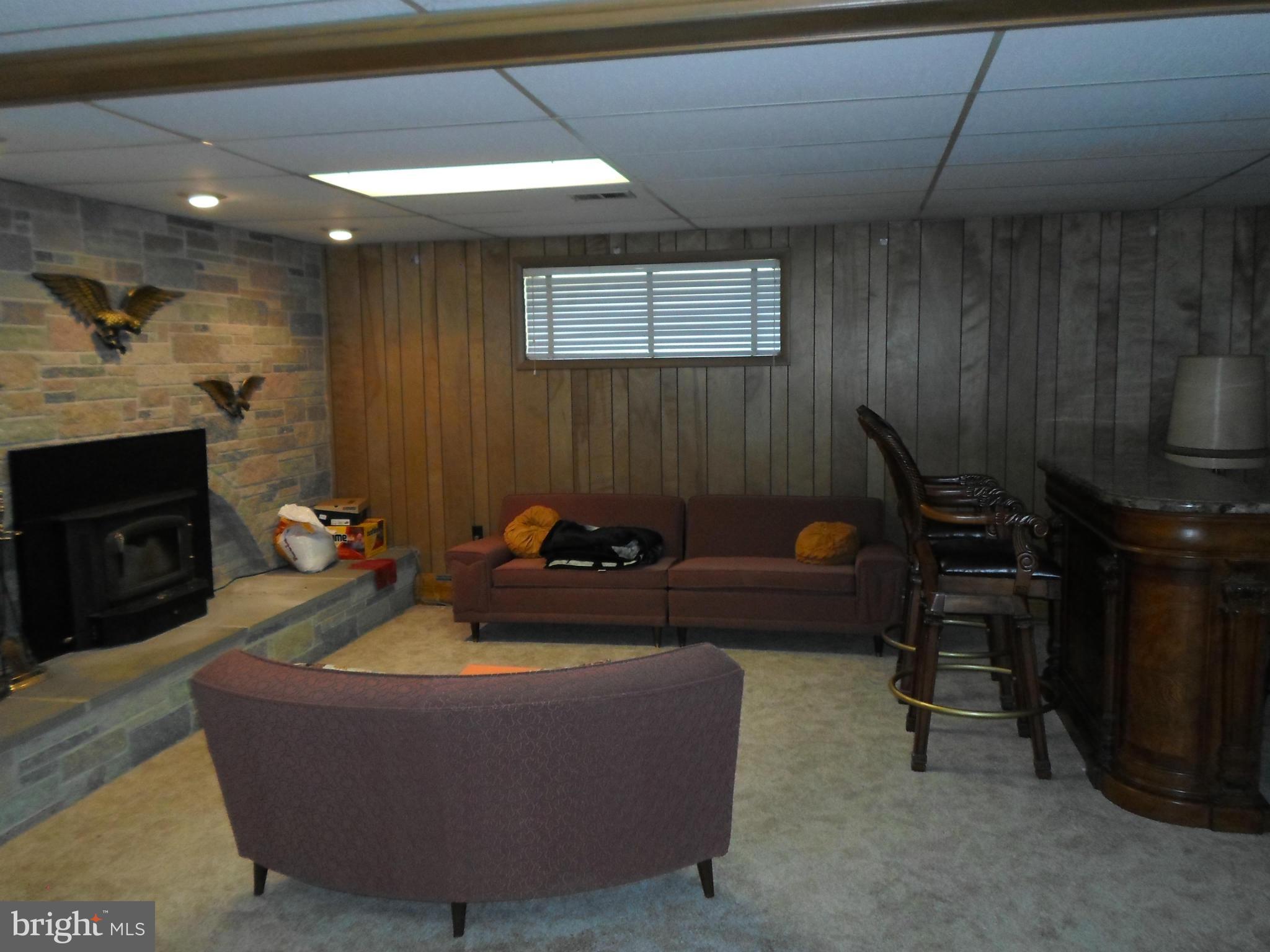 7410 South Osborne Road Upper Marlboro, MD 20772 - Photo 23 of 30 a living room with furniture and a fireplace