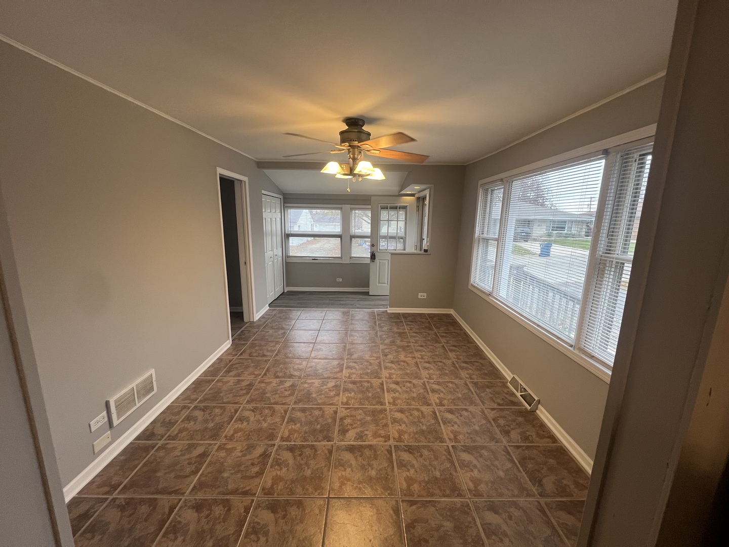 1817 Cora Street Crest Hill, IL 60403 - Photo 5 of 19 wooden floor in an empty room with a window