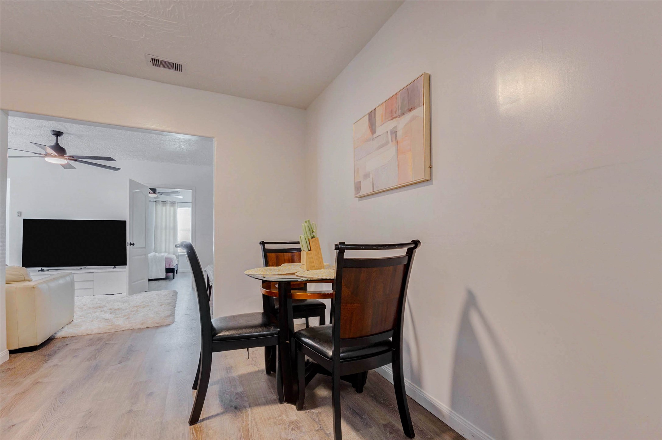 2902 Truxillo Street Houston, TX 77004 - Photo 14 of 32 a view of a dining room with furniture and wooden floor