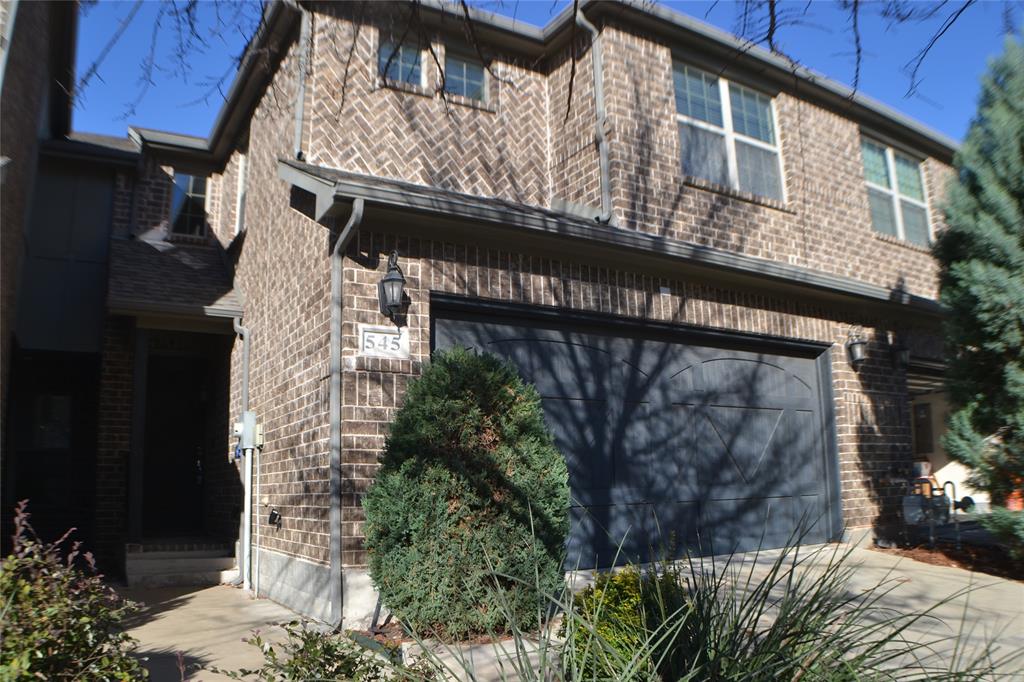 a view of a house with a tree