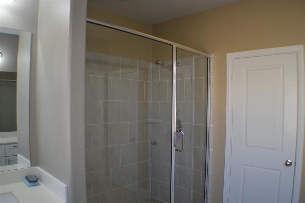 545 Teton Street Allen, TX 75002 - Photo 8 of 19 a bathroom with a shower and a sink