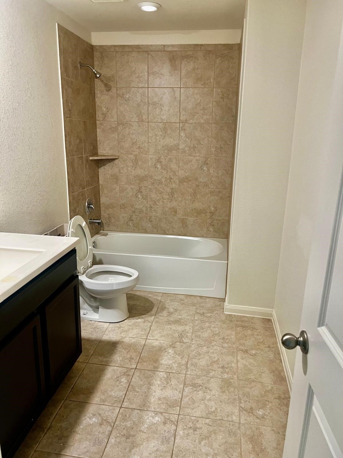 6159 El Oro Drive Houston, TX 77048 - Photo 7 of 10 a bathroom with a toilet a sink and shower