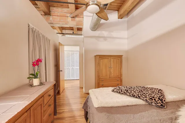 a bedroom with a bed and a dresser