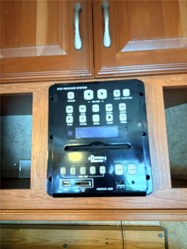 208 Reston Way Westminster, SC 29693 - Photo 6 of 26 Functional entertainment system seamlessly integrated into custom cabinetry.