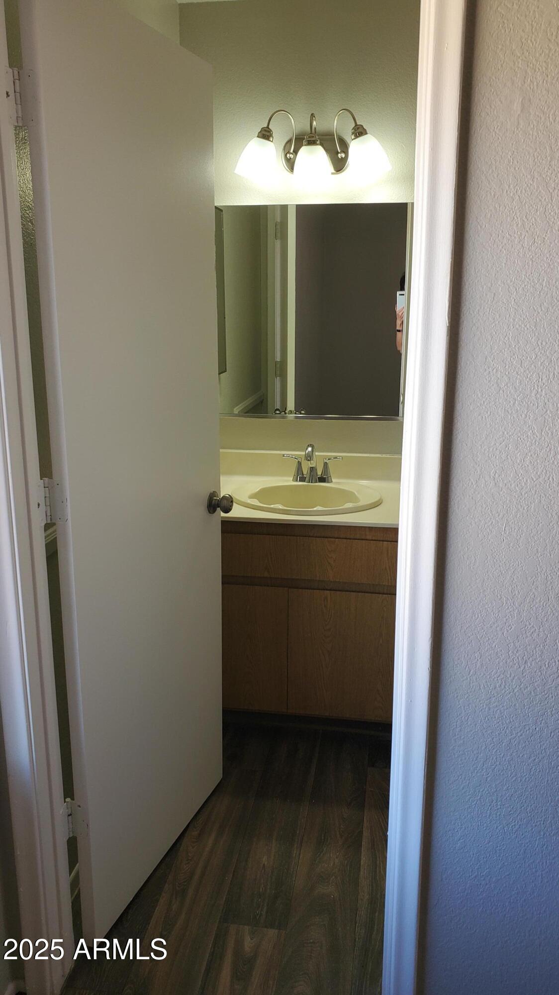2737 North Salem, Unit 201 Mesa, AZ 85215 - Photo 12 of 17 a bathroom with a sink and a mirror