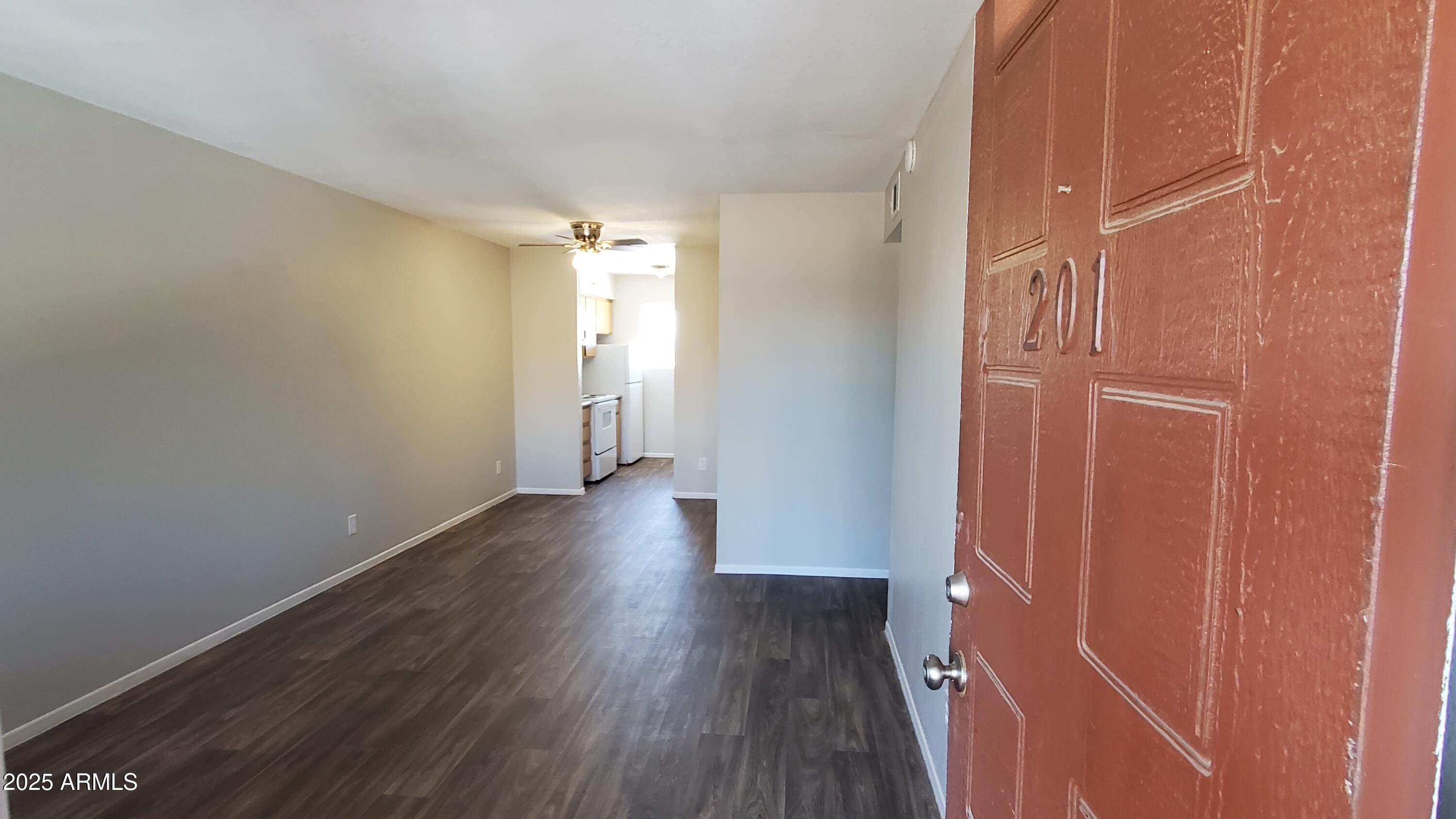 2737 North Salem, Unit 201 Mesa, AZ 85215 - Photo 3 of 17 a view of a hallway with wooden floor