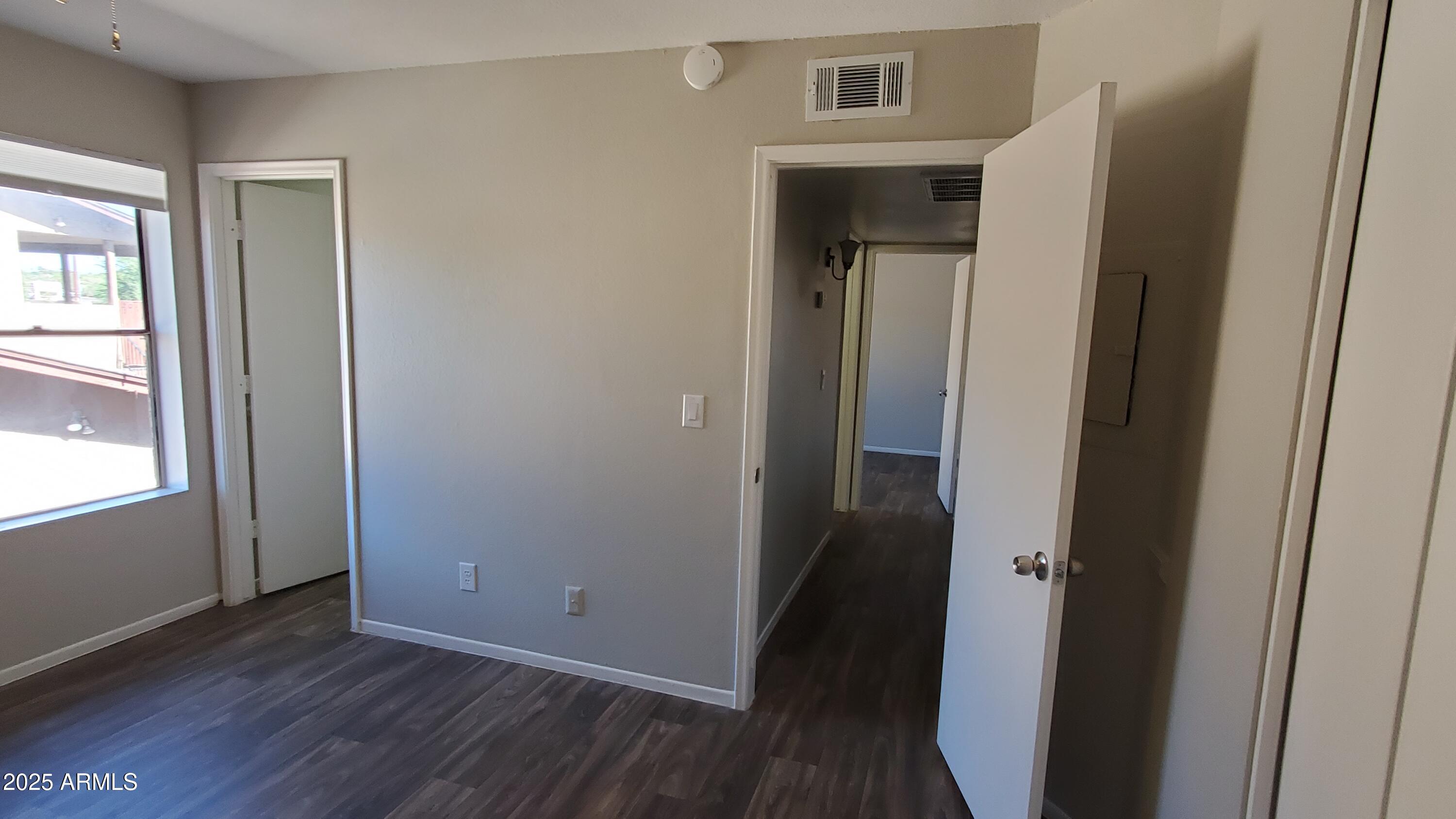 2737 North Salem, Unit 201 Mesa, AZ 85215 - Photo 10 of 17 a view of a hallway with wooden floor