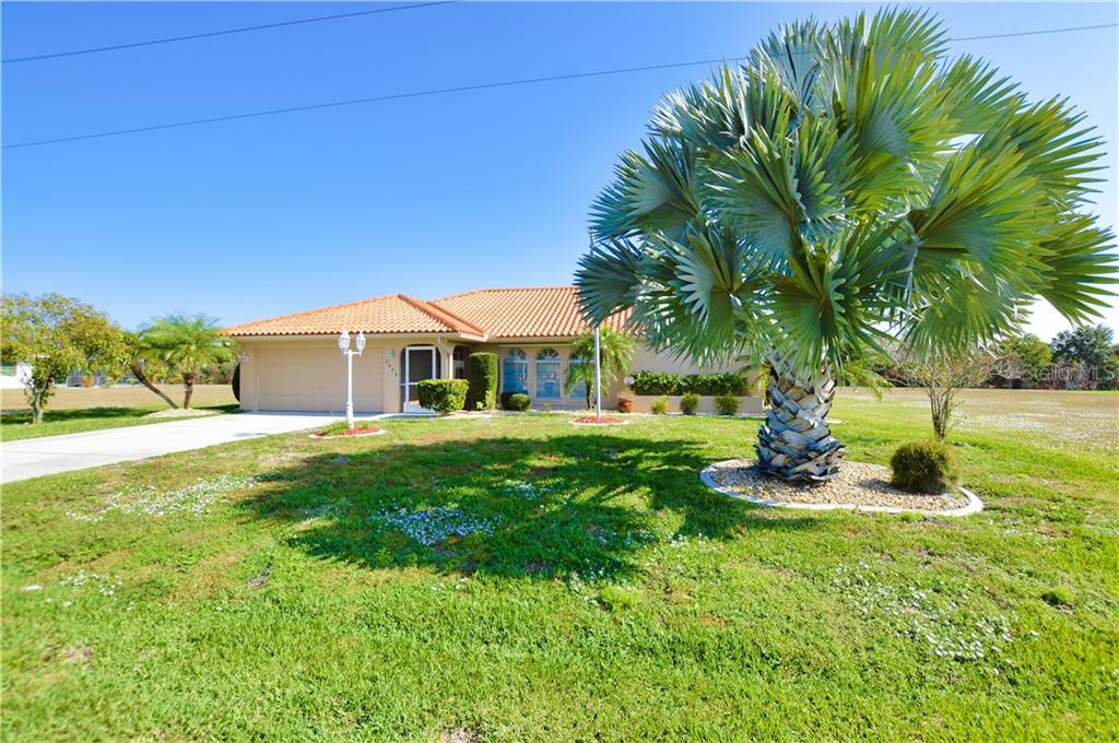 2446 Mauritania Road Punta Gorda, FL 33983 - Photo 1 of 1 a front view of a house with a yard