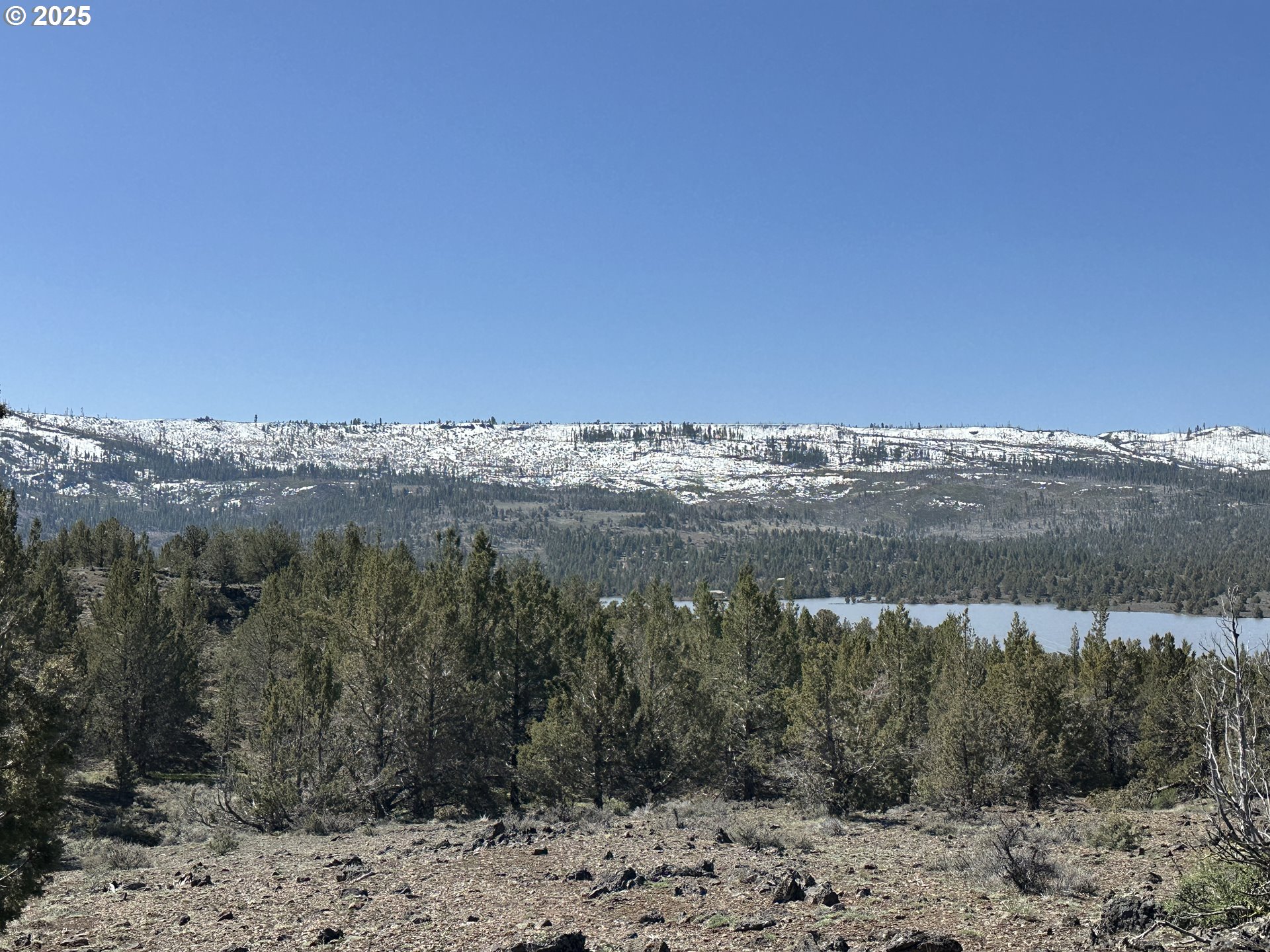 Cyhoya Way Lakeview, OR 97630 - Photo 23 of 36 a view of a lake with a mountain in the background