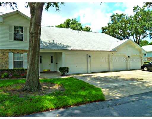 5266 Whitstable Way, Unit 8 Orlando, FL 32812 - Photo 1 of 1 Exterior Front - The garage for this unit is the last one on the right